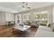 Bright living room featuring a dining area, patio access, and comfortable seating at 3994 Knott Dr, Apopka, FL 32712