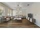 Well-lit living room with modern furnishings, a ceiling fan, and natural light at 3994 Knott Dr, Apopka, FL 32712