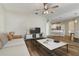 Open living area with kitchen breakfast bar, dining table, and comfortable sofa at 3994 Knott Dr, Apopka, FL 32712