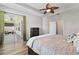 Spacious main bedroom with a king-size bed and a sliding glass door to the patio at 3994 Knott Dr, Apopka, FL 32712