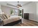 Comfortable main bedroom with tray ceiling, fan, and backyard access at 3994 Knott Dr, Apopka, FL 32712