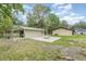 View of the backyard highlighting the home and additional building at 4085 Cypress Bend, Geneva, FL 32732