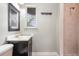 Bathroom boasting a dark vanity and a tiled shower at 4085 Cypress Bend, Geneva, FL 32732