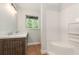 Bathroom showcasing a vanity with dual sinks and a shower-tub combination at 4085 Cypress Bend, Geneva, FL 32732