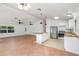 Well-lit kitchen featuring modern white cabinets, butcher block countertops, stainless steel appliances, and an eat-in island at 4085 Cypress Bend, Geneva, FL 32732