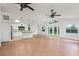 An open floor plan with tile flooring seamlessly connects the living room to a modern, stylish kitchen at 4085 Cypress Bend, Geneva, FL 32732