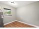 Cozy room with wood floors and natural light from a window at 4085 Cypress Bend, Geneva, FL 32732