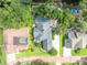 An aerial view of a home showing its pool and backyard bordered by a canal, perfect for waterfront living at 413 Harbour Oaks Pointe Dr, Edgewood, FL 32809