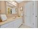 Bright bathroom with granite counters, a large mirror, and access to the walk-in closet at 413 Harbour Oaks Pointe Dr, Edgewood, FL 32809