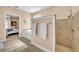 This bathroom has a walk-in shower, soaking tub, and double towel rack at 413 Harbour Oaks Pointe Dr, Edgewood, FL 32809