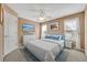 Inviting bedroom with soft blue accents, a large window, and neutral wall color at 413 Harbour Oaks Pointe Dr, Edgewood, FL 32809