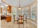 Bright breakfast nook with ample windows and adjacent workspace overlooking the pool at 413 Harbour Oaks Pointe Dr, Edgewood, FL 32809