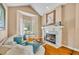 Bright living room featuring hardwood floors, a fireplace, and large windows with natural light at 413 Harbour Oaks Pointe Dr, Edgewood, FL 32809