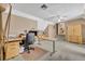 Office featuring neutral walls, a desk, a chair, and a set of stairs at 413 Harbour Oaks Pointe Dr, Edgewood, FL 32809