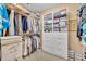Spacious walk-in closet with custom shelving and ample storage space at 413 Harbour Oaks Pointe Dr, Edgewood, FL 32809