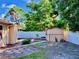 The backyard featuring a storage shed, and partial fence offering a private outdoor space at 435 Andes Ave, Orlando, FL 32807