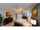 Staged bedroom with neutral walls, ceiling fan, and furnishings, creating a cozy and inviting space at 435 Andes Ave, Orlando, FL 32807
