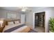 Inviting bedroom with a wood bed frame, walk-in closet, and a tranquil decor at 435 Andes Ave, Orlando, FL 32807