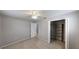 Bedroom features carpet flooring, ceiling fan, and walk-in closet at 435 Andes Ave, Orlando, FL 32807