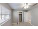 Bedroom features carpet flooring, blinds on the window and closet at 435 Andes Ave, Orlando, FL 32807