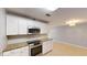 Modern kitchen featuring granite countertops, stainless steel appliances, and ample cabinet space at 435 Andes Ave, Orlando, FL 32807