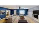 Cozy living room featuring a brick fireplace, neutral paint, and comfortable seating at 435 Andes Ave, Orlando, FL 32807