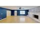 Open-concept living room with tile floors, a fireplace, and a contemporary ceiling fan at 435 Andes Ave, Orlando, FL 32807