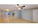 Open living room with tile flooring, and a view of the kitchen with stainless steel appliances at 435 Andes Ave, Orlando, FL 32807