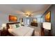 Spacious main bedroom featuring a ceiling fan, and natural light from a rear door and windows at 435 Andes Ave, Orlando, FL 32807