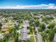 Expansive aerial view of a residential neighborhood with mature trees and a few homes featuring private swimming pools at 4611 Cranston Pl, Orlando, FL 32812