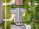 Aerial view of home with a well-maintained roof and lush landscaping at 4611 Cranston Pl, Orlando, FL 32812