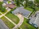 Aerial view of a single-Gathering home showcasing its driveway and neighboring residences at 4611 Cranston Pl, Orlando, FL 32812