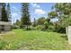 Spacious backyard offering ample green space and partial fencing at 4611 Cranston Pl, Orlando, FL 32812