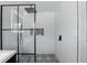 Modern shower with a glass enclosure, rainfall showerhead, and patterned tile accent niche at 4611 Cranston Pl, Orlando, FL 32812