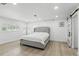 Bright bedroom with a bed, and a sliding barn door closet at 4611 Cranston Pl, Orlando, FL 32812