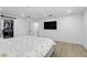 Bright bedroom with a bed, a sliding barn door closet, and a TV at 4611 Cranston Pl, Orlando, FL 32812