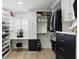 Spacious walk-in closet with custom shelving, drawers, a vanity, and natural light at 4611 Cranston Pl, Orlando, FL 32812