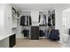 Large custom walk-in closet with built-in shelving, drawers, and ample hanging space at 4611 Cranston Pl, Orlando, FL 32812