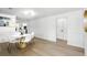 Chic dining room area features wood flooring, modern lighting, and an open concept design at 4611 Cranston Pl, Orlando, FL 32812