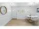 Elegant dining area with hardwood floors, bright lighting, and ample space for entertaining at 4611 Cranston Pl, Orlando, FL 32812