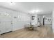 Bright dining room features wood floors, natural light and modern decor at 4611 Cranston Pl, Orlando, FL 32812