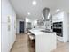Light filled kitchen with stainless appliances, large island, and ample storage cabinets at 4611 Cranston Pl, Orlando, FL 32812