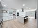 Updated kitchen boasts stainless appliances, a center island with seating, and stylish backsplash at 4611 Cranston Pl, Orlando, FL 32812