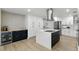 Stylish kitchen showcasing custom cabinetry, a center island, and contemporary finishes at 4611 Cranston Pl, Orlando, FL 32812