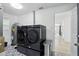 Modern laundry room with front load machines and bold, patterned floor tile at 4611 Cranston Pl, Orlando, FL 32812