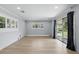 Living room with a pair of windows and a sliding glass door at 4611 Cranston Pl, Orlando, FL 32812