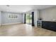 Living room with a sliding glass door, a window, and a wet bar at 4611 Cranston Pl, Orlando, FL 32812
