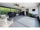 Large screened patio with ceiling fans providing ample space for outdoor living at 4611 Cranston Pl, Orlando, FL 32812