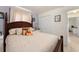 Bedroom featuring a spacious bed and white nightstand for storage, lit by an overhead light at 470 Cardinal Ct, Kissimmee, FL 34759