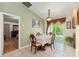 Bright dining area with access to the yard and views into the living room at 470 Cardinal Ct, Kissimmee, FL 34759